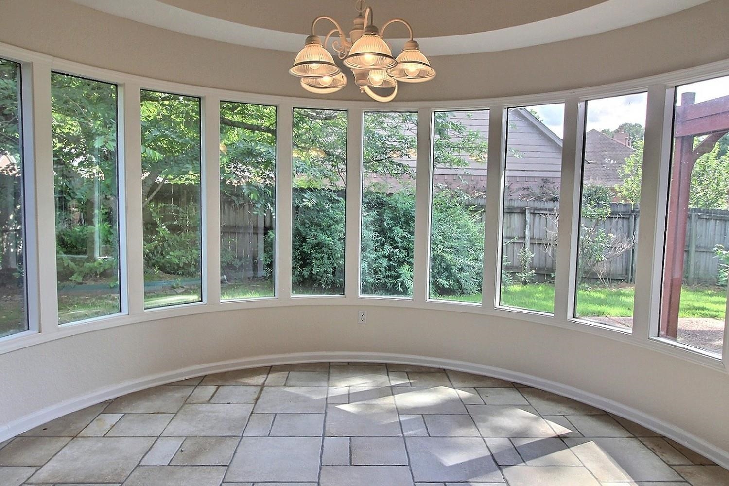 275 Home Place Collierville, TN 38017 - Photo 8 of 18 Unfurnished sunroom with a chandelier