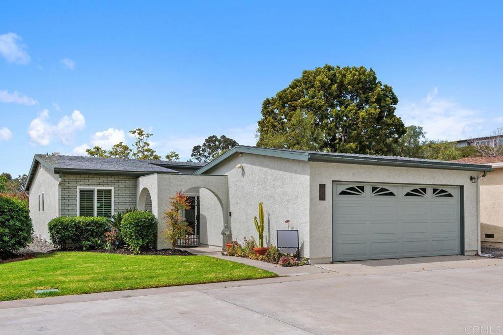 3709 Sesame Way Oceanside, CA 92057 - Photo 1 of 39 a front view of a house with garden