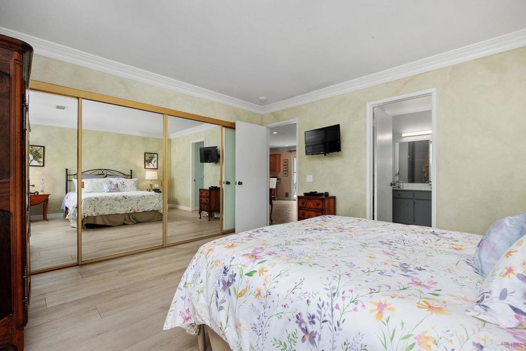 3709 Sesame Way Oceanside, CA 92057 - Photo 20 of 39 a bedroom with a large bed and a flat tv screen