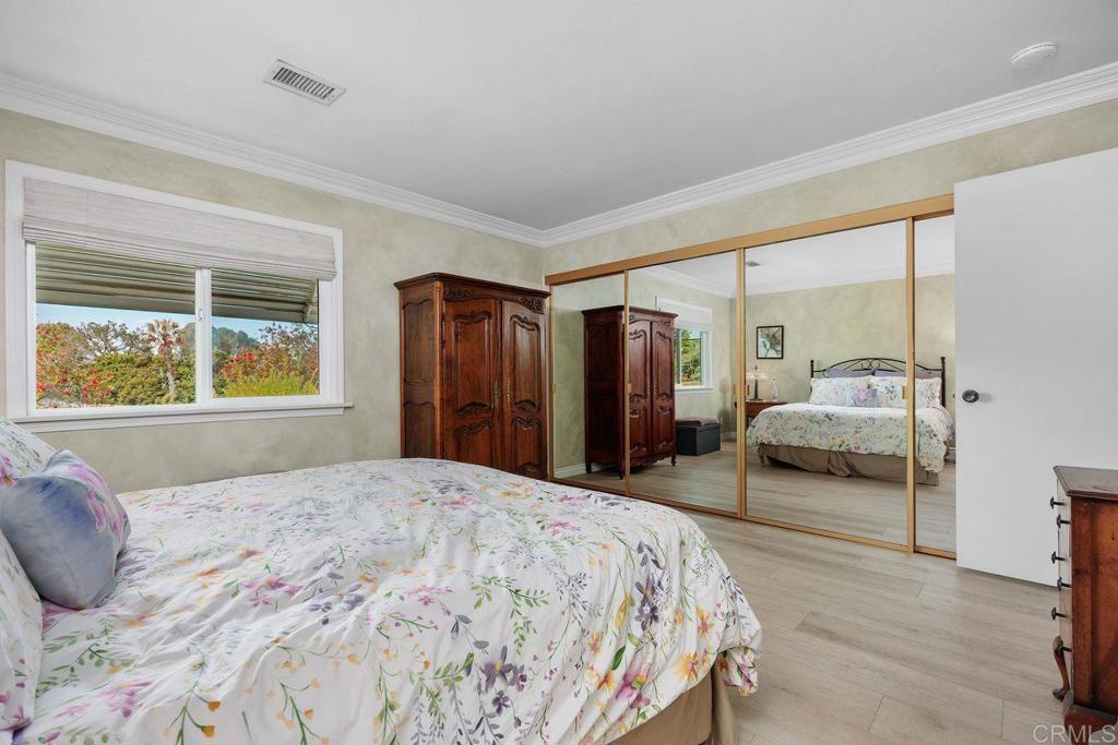 3709 Sesame Way Oceanside, CA 92057 - Photo 21 of 39 a bedroom with a large bed and a window
