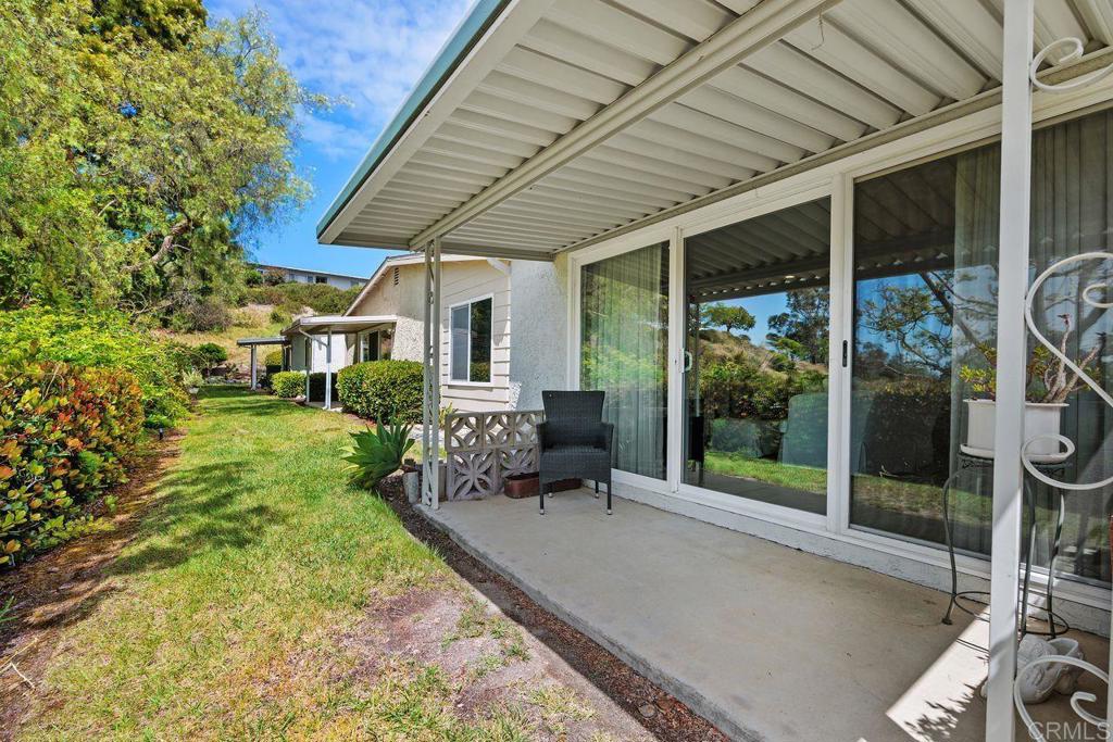 3709 Sesame Way Oceanside, CA 92057 - Photo 32 of 39 a patio with yard glass top table and chairs