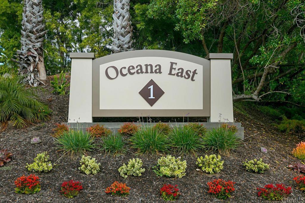 3709 Sesame Way Oceanside, CA 92057 - Photo 33 of 39 a sign that is sitting in front of flowers