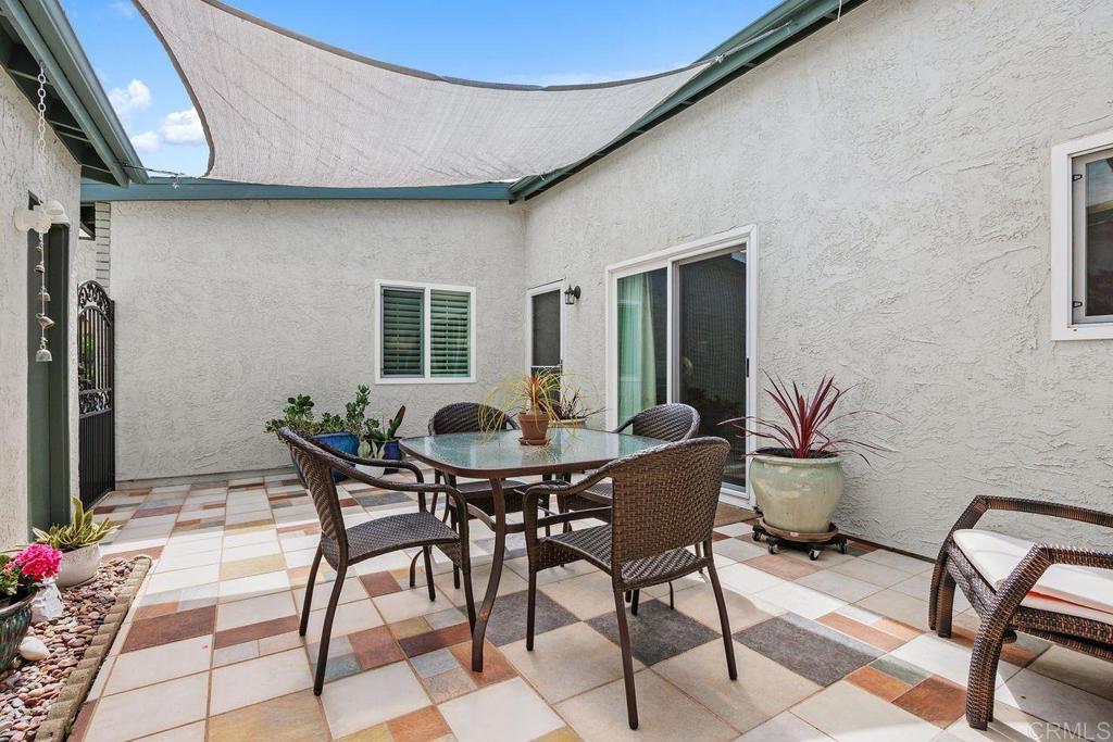 3709 Sesame Way Oceanside, CA 92057 - Photo 5 of 39 a backyard of a house with table and chairs