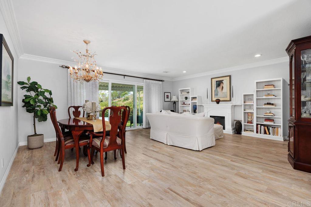 3709 Sesame Way Oceanside, CA 92057 - Photo 8 of 39 a view of a dining room with furniture and wooden floor