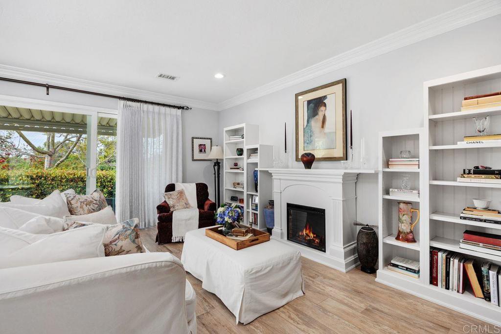 3709 Sesame Way Oceanside, CA 92057 - Photo 9 of 39 a living room with furniture large window and a fireplace