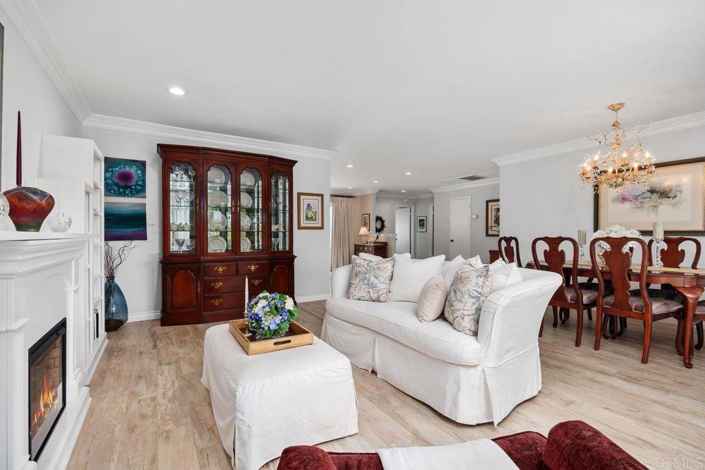 3709 Sesame Way Oceanside, CA 92057 - Photo 10 of 39 a living room with furniture a fireplace and a table