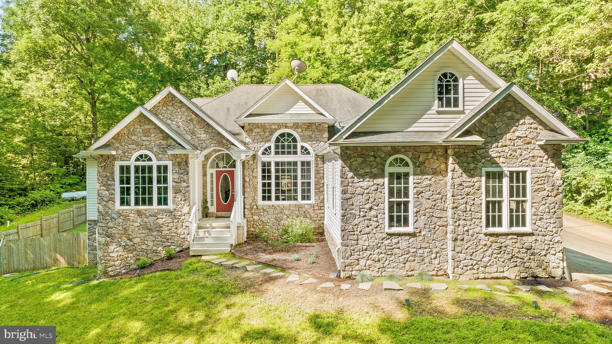 1808 Wilson Road Huntingtown, MD 20639 - Photo 1 of 53 a front view of a house with a yard