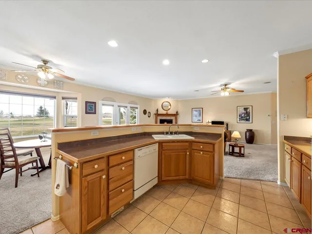 a kitchen with stainless steel appliances granite countertop a sink and cabinets