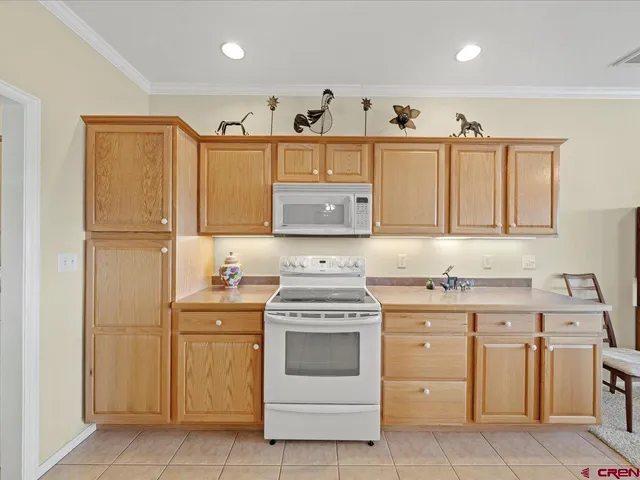 a kitchen with a stove sink and cabinets