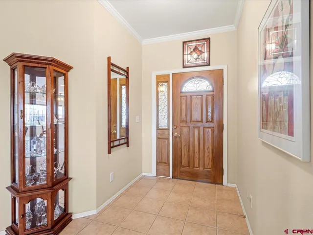 a view of an entryway with a mirror