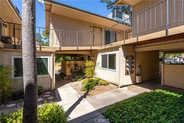 a front view of a house with a yard outdoor seating and a garage