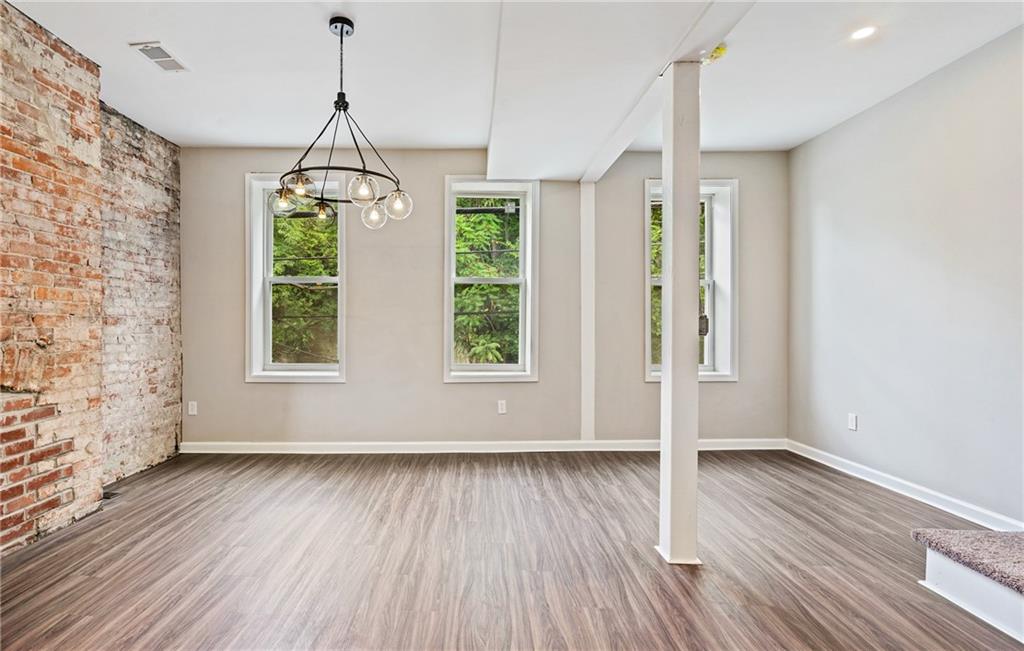 1127 Troy Hill Road Pittsburgh, PA 15212 - Photo 14 of 25 a view of empty room with wooden floor and windows