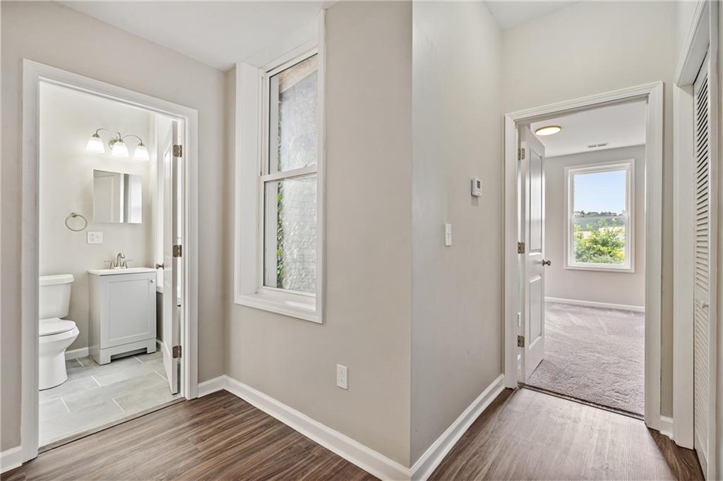 1127 Troy Hill Road Pittsburgh, PA 15212 - Photo 18 of 25 a view of a bathroom with a glass door and a bathroom