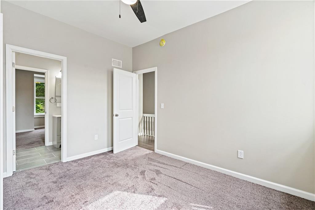 1127 Troy Hill Road Pittsburgh, PA 15212 - Photo 22 of 25 an empty room with closet and windows