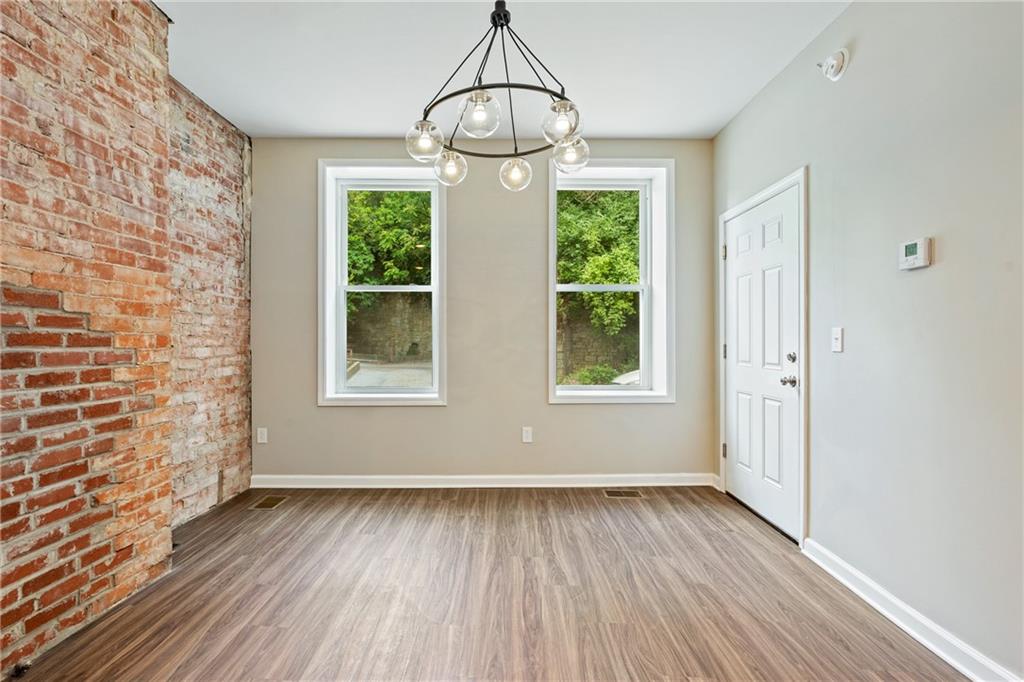 1127 Troy Hill Road Pittsburgh, PA 15212 - Photo 3 of 25 a view of livingroom with hardwood floor and window