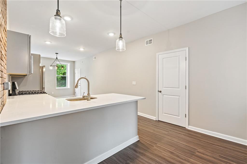 1127 Troy Hill Road Pittsburgh, PA 15212 - Photo 6 of 25 a view of a sink and wooden floor