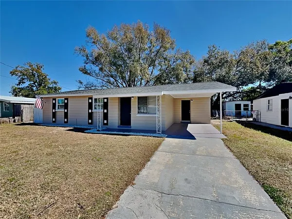 front view of a house with a yard