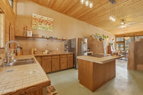 a kitchen with a stove and cabinets