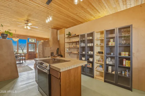 a kitchen that has a lot of cabinets in it