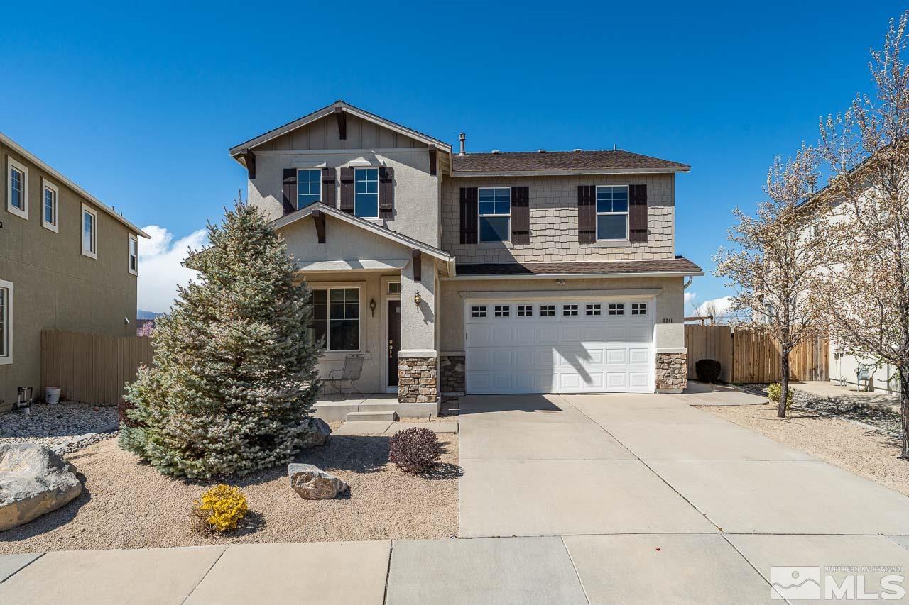 2241 Big Trail Circle Reno, NV 89521 - Photo 1 of 40 a front view of a house with a yard