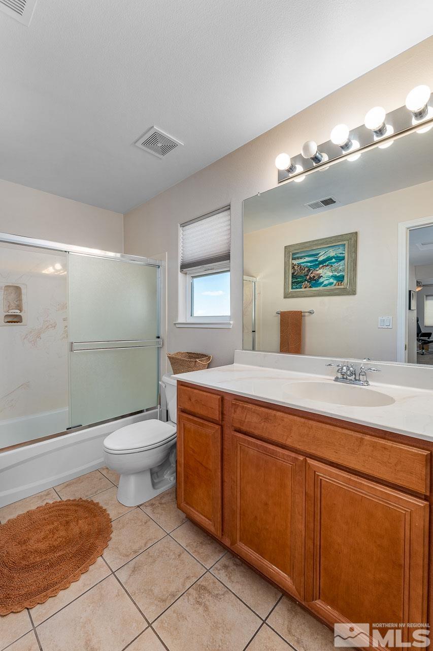 2241 Big Trail Circle Reno, NV 89521 - Photo 12 of 40 a bathroom with a toilet sink and shower