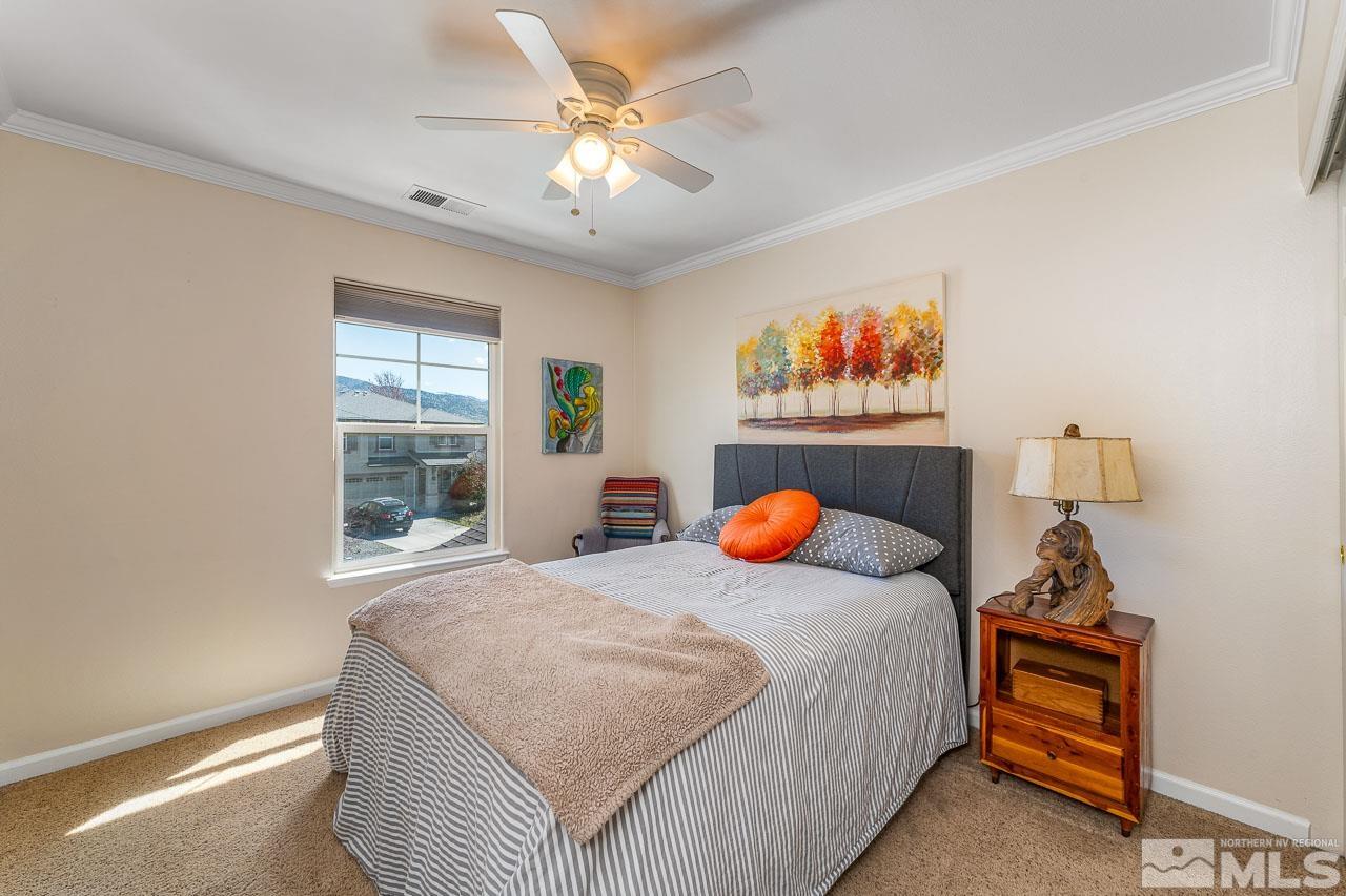 2241 Big Trail Circle Reno, NV 89521 - Photo 14 of 40 a bedroom with bed and window