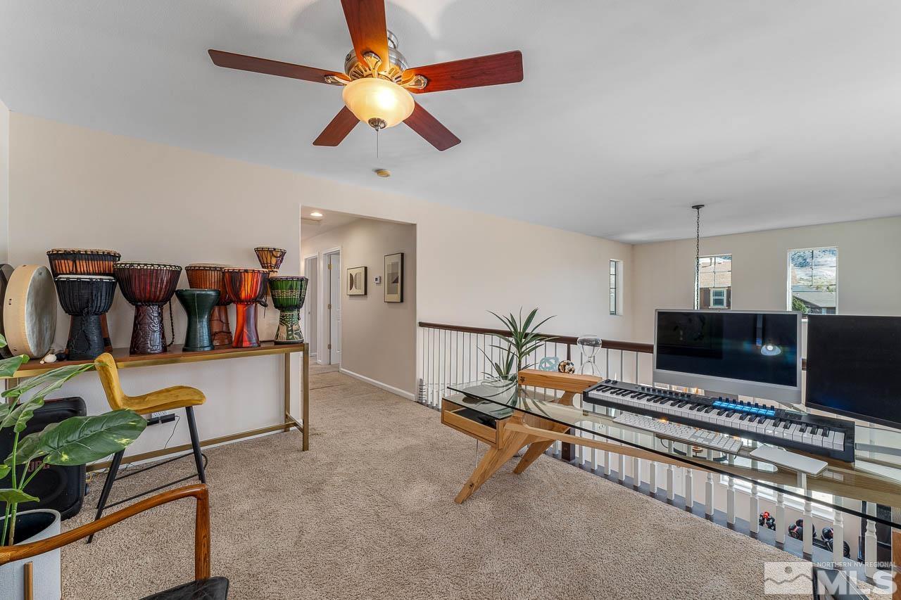 2241 Big Trail Circle Reno, NV 89521 - Photo 16 of 40 a living room with furniture and a flat screen tv