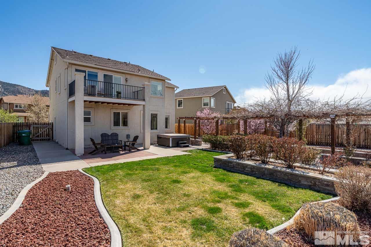 2241 Big Trail Circle Reno, NV 89521 - Photo 31 of 40 a view of a house with backyard patio and swimming pool