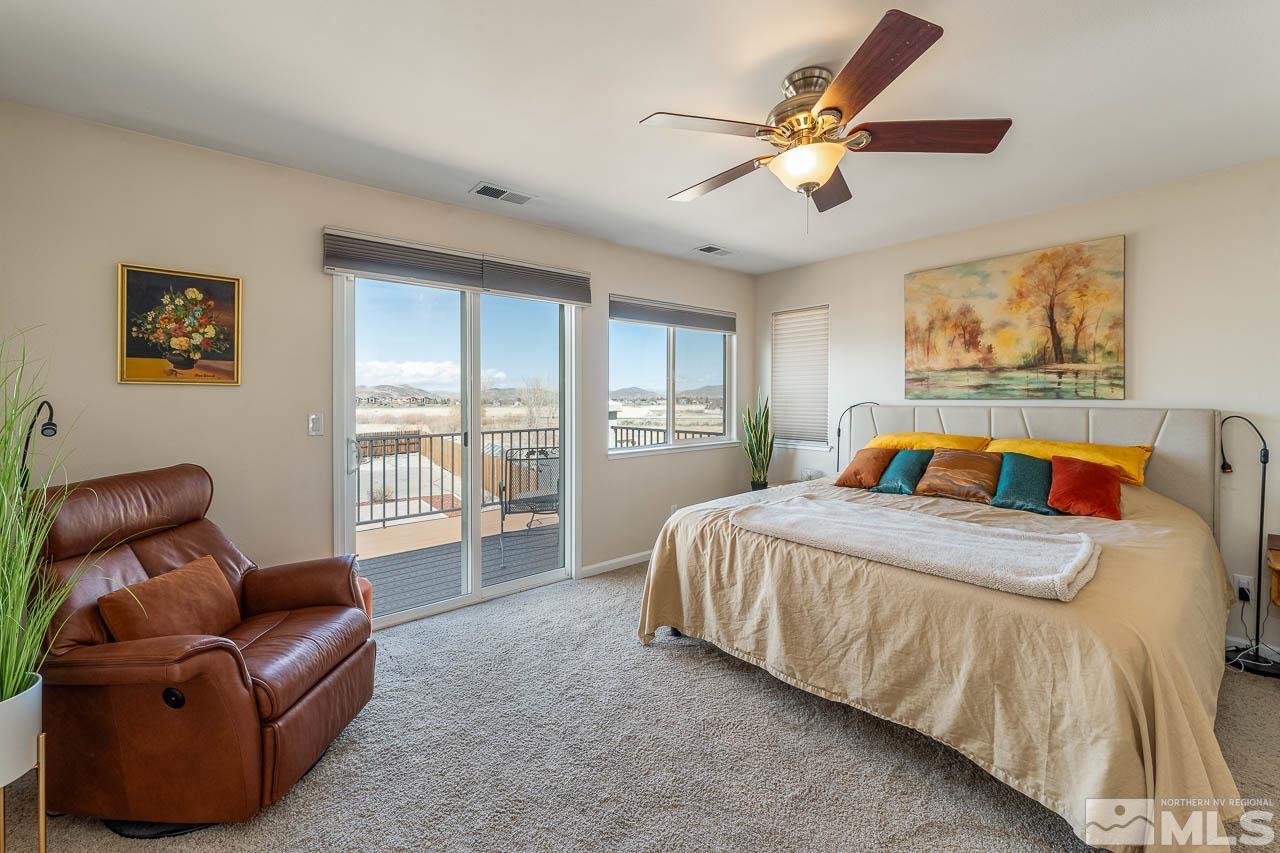 2241 Big Trail Circle Reno, NV 89521 - Photo 9 of 40 a bed room with a bed and a couch