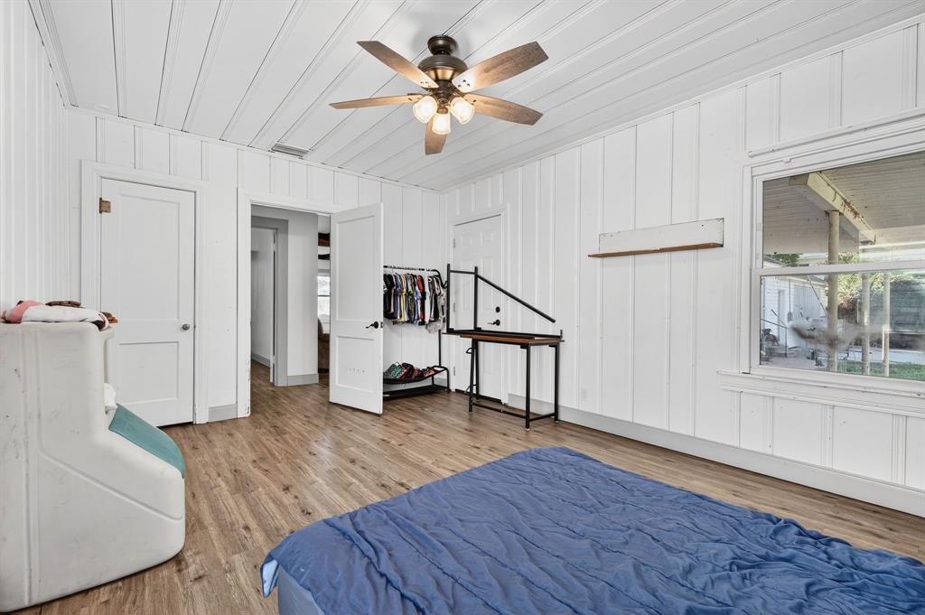 605 Highway 36 Comanche, TX 76442 - Photo 11 of 36 a view of an empty room with a window and wooden floor