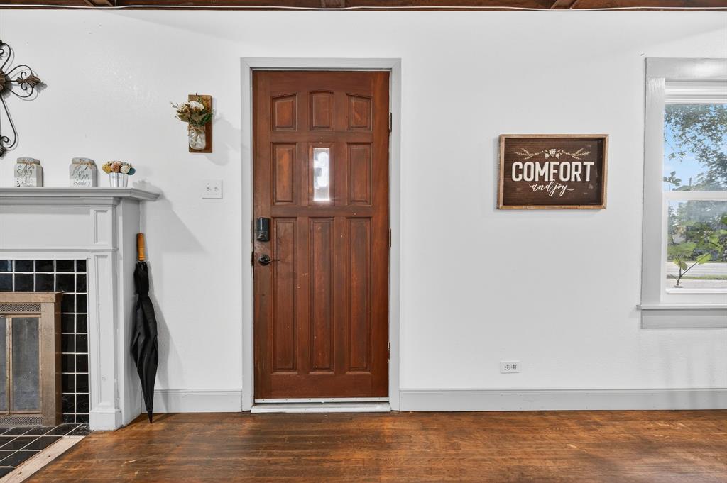 605 Highway 36 Comanche, TX 76442 - Photo 2 of 36 a view of a hallway with front door and wooden floor