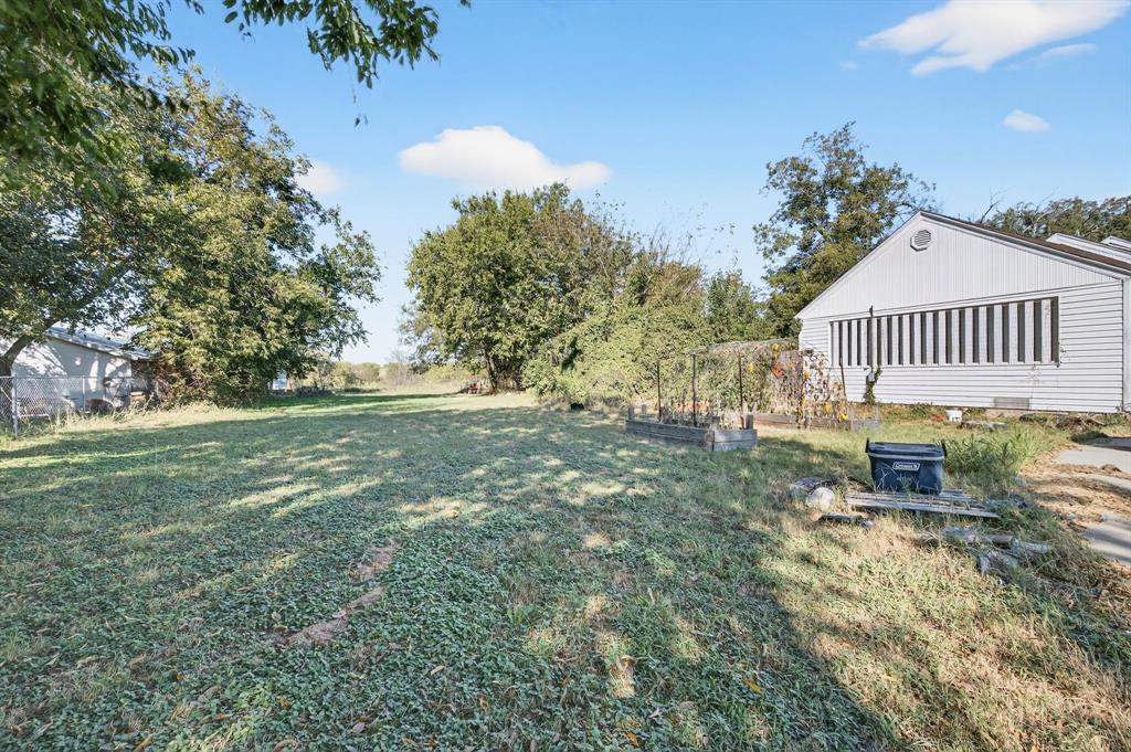 605 Highway 36 Comanche, TX 76442 - Photo 27 of 36 a view of a house with a yard