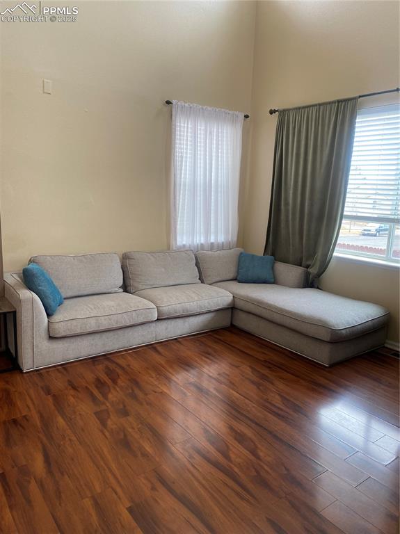 7215 Canal Point Colorado Springs, CO 80922 - Photo 11 of 24 a living room with furniture and a wooden floor