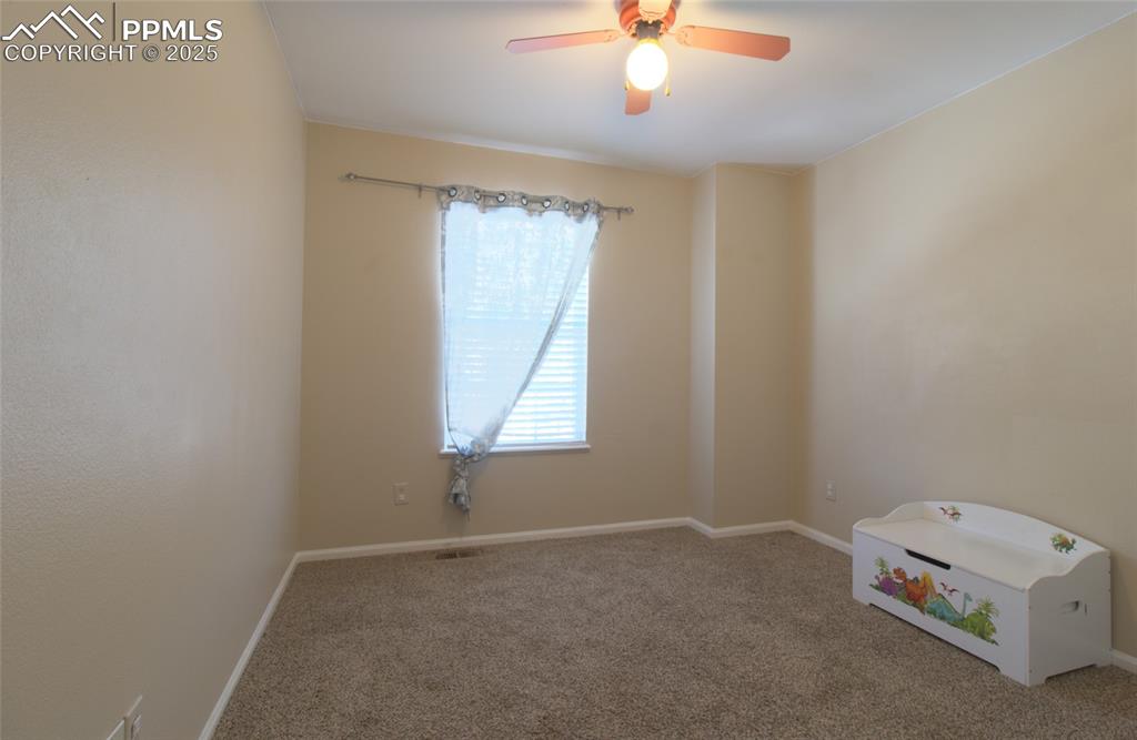 7215 Canal Point Colorado Springs, CO 80922 - Photo 17 of 24 an empty room with a window