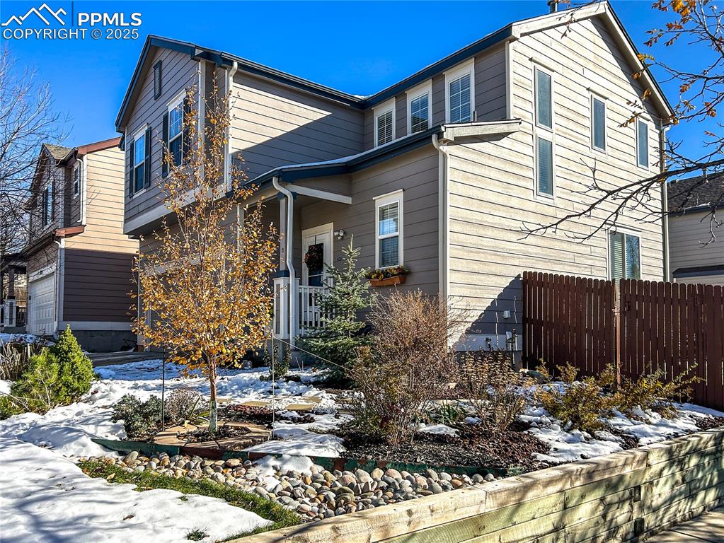 7215 Canal Point Colorado Springs, CO 80922 - Photo 2 of 24 a view of a house with a yard and sitting area