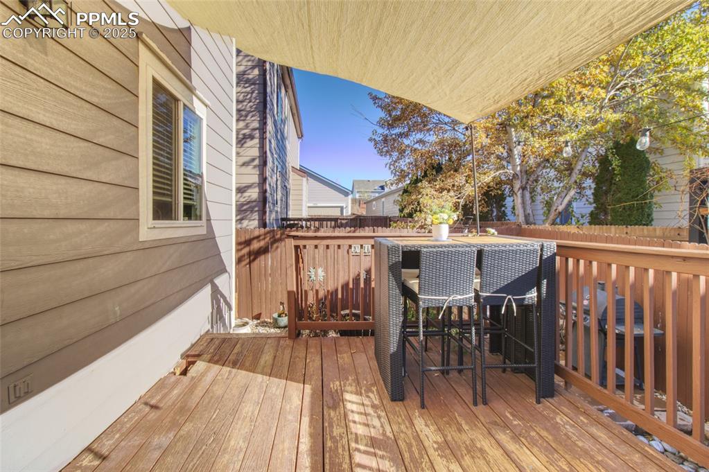 7215 Canal Point Colorado Springs, CO 80922 - Photo 21 of 24 a view of a house with a patio and wooden floor