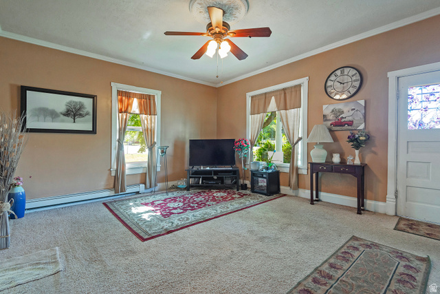 178 17th Street Ogden, UT 84404 - Photo 10 of 29 Interior living space featuring light-colored carpet, a ceiling fan with light fixture, and crown molding