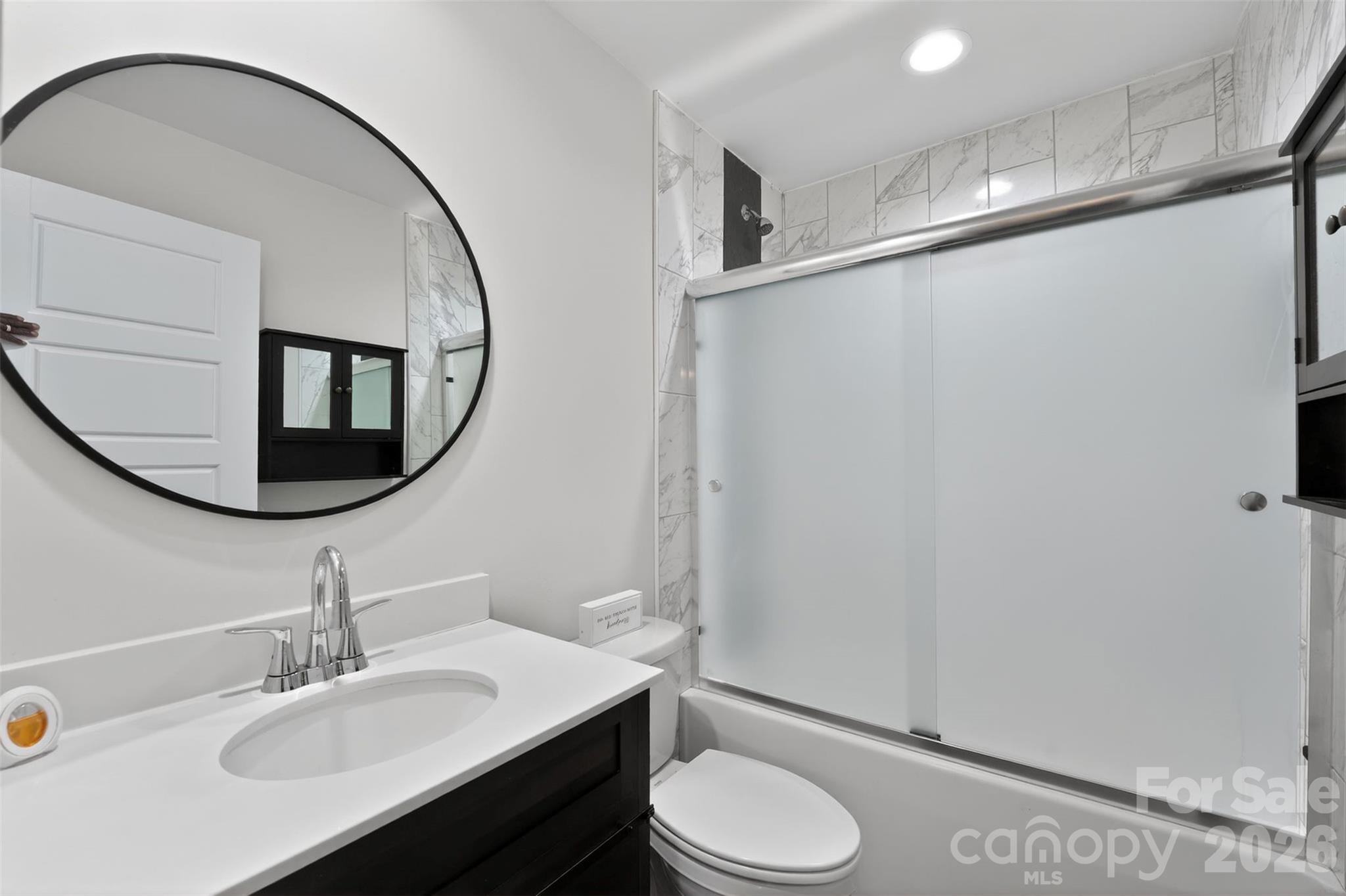 123 Rowe Street Gastonia, NC 28056 - Photo 12 of 20 a bathroom with a sink mirror vanity and toilet