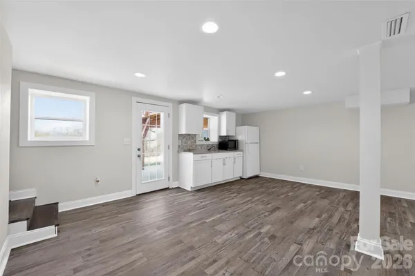 a view of kitchen and wooden floor