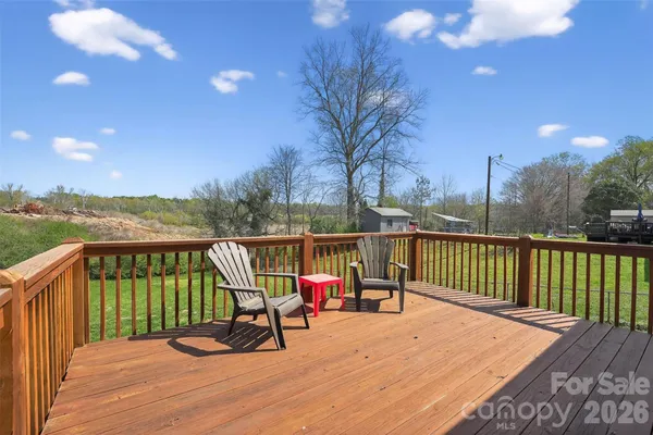 a view of a two chairs on the roof deck
