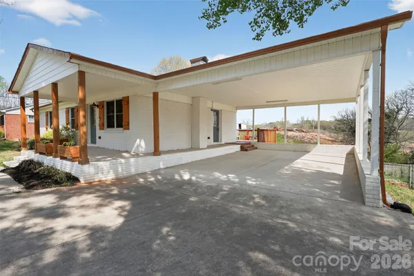 a view of a parking space in front of a building