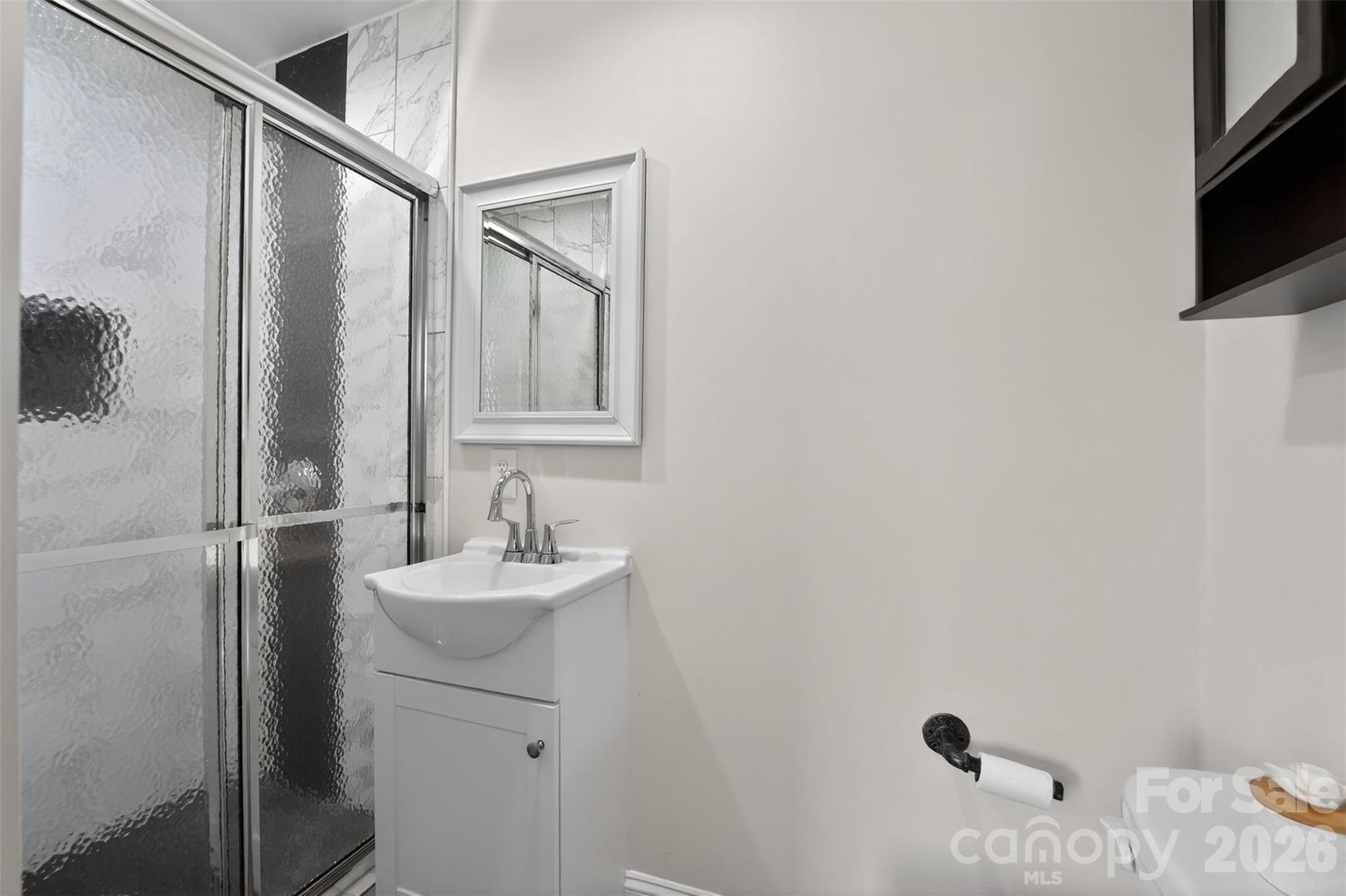 123 Rowe Street Gastonia, NC 28056 - Photo 9 of 20 a bathroom with a sink a mirror and shower