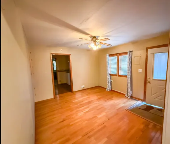 a view of an empty room with a fireplace