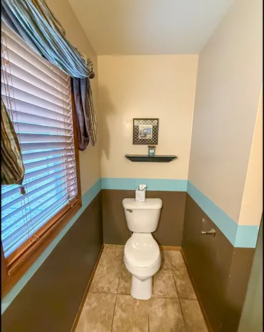 a bathroom with a toilet and a sink