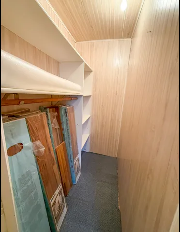 a bathroom with a sink and mirror with shower