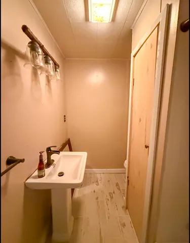 a view of an empty room with a window and a ceiling fan
