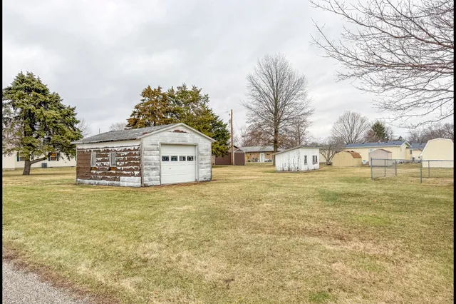 a view of a big yard with large trees