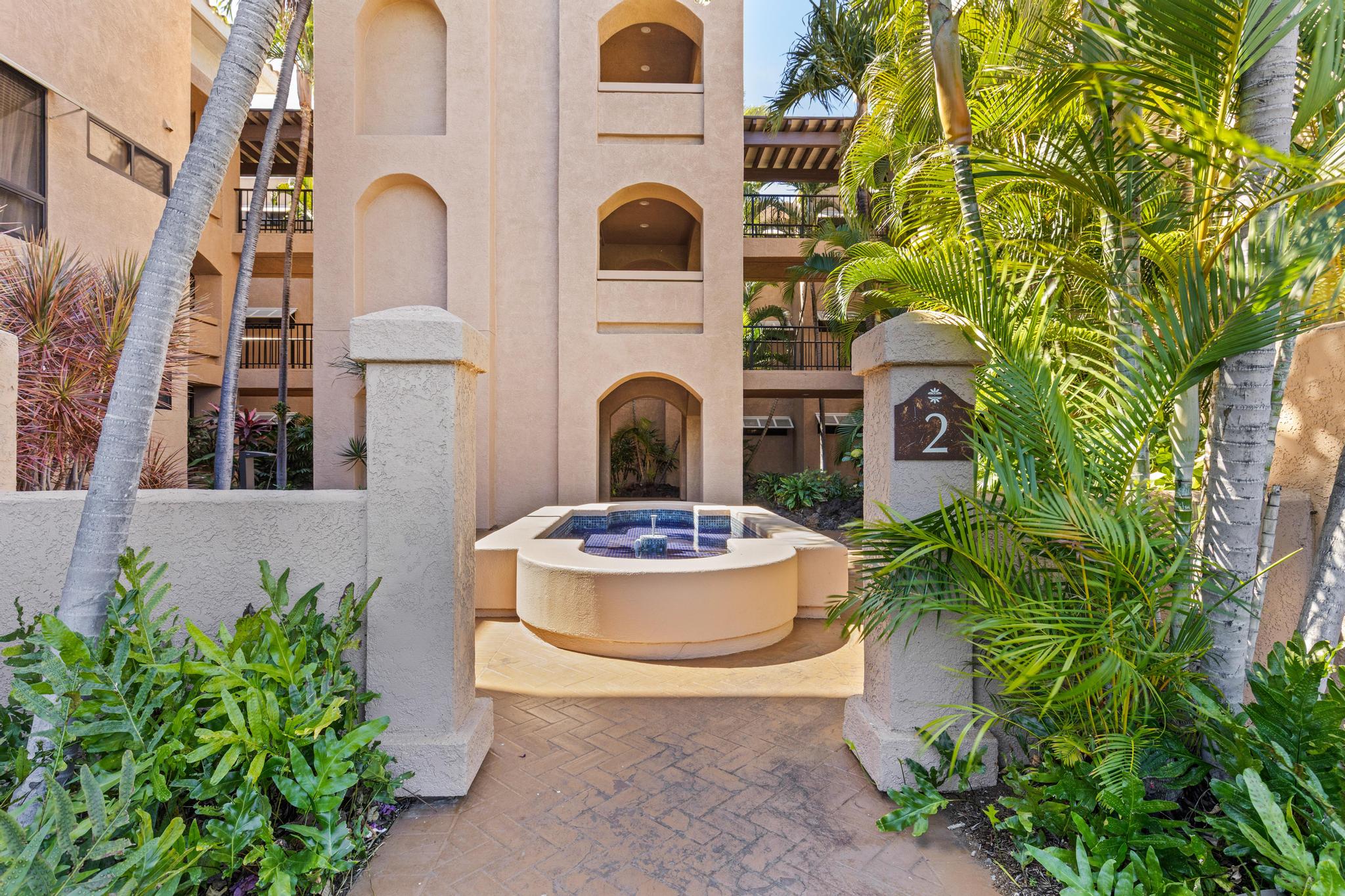 69-450 Bay Club, Unit 236 Waikoloa, HI 96738 - Photo 21 of 22 a front view of a house with plants and garden
