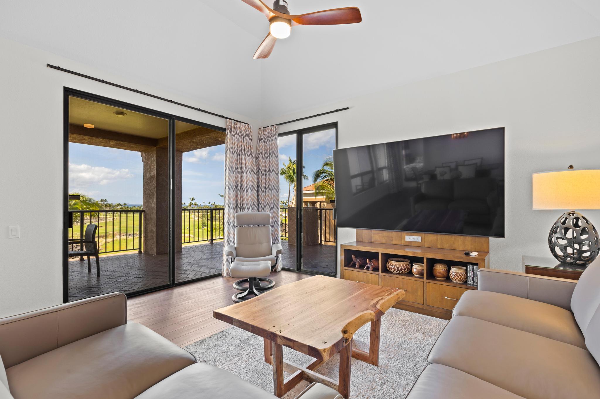 69-450 Bay Club, Unit 236 Waikoloa, HI 96738 - Photo 6 of 22 a living room with furniture and a flat screen tv