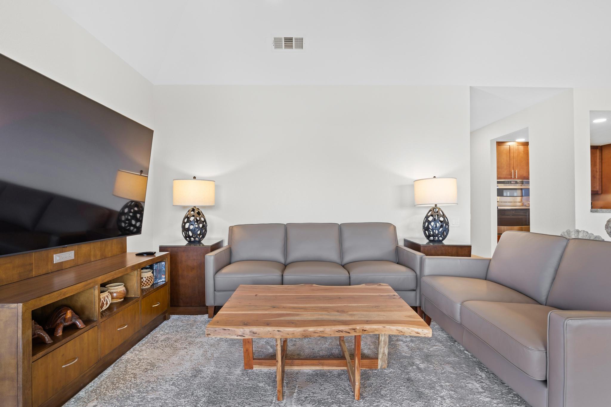 69-450 Bay Club, Unit 236 Waikoloa, HI 96738 - Photo 10 of 22 a living room with furniture and a flat screen tv